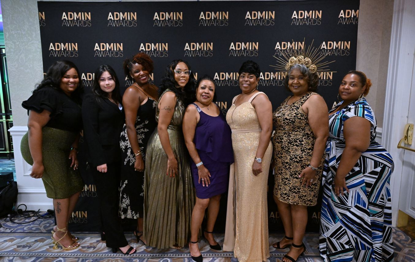 Photo: From left, UMB employees Krishauna Greene, Christina Cortese, Danielle Hill, Latoya Ludd, Saifa Poole, Eris Smith, Alvette Chase, and Brittany Johnson attended the “Good as Gold” award ceremony