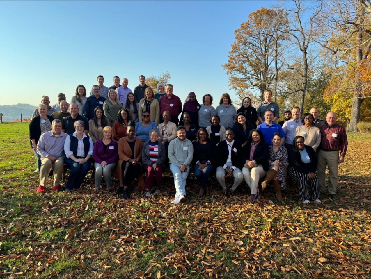 Members of the A&F leadership team post outside. 