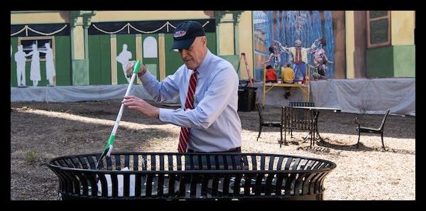 UMB President Bruce Jarrell demonstrates a commitment to sustainability during a recent campus cleanup day sponsored by the Office of Sustainability and the Staff Senate.