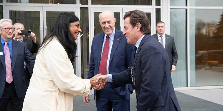 Lt. Gov. Aruna Miller shakes hands with School of Medicine Dean Mark T. Gladwin