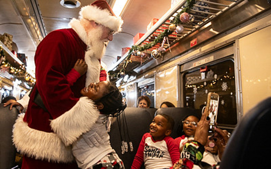 Polar Express passengers enjoy a chat with Santa