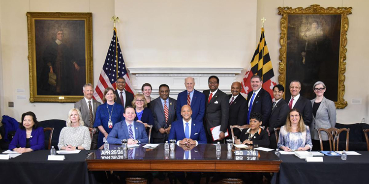 Maryland Gov. Wes Moore, UMB President Bruce Jarrell, and others