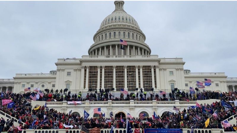 Rioters crowd the US Capitol building