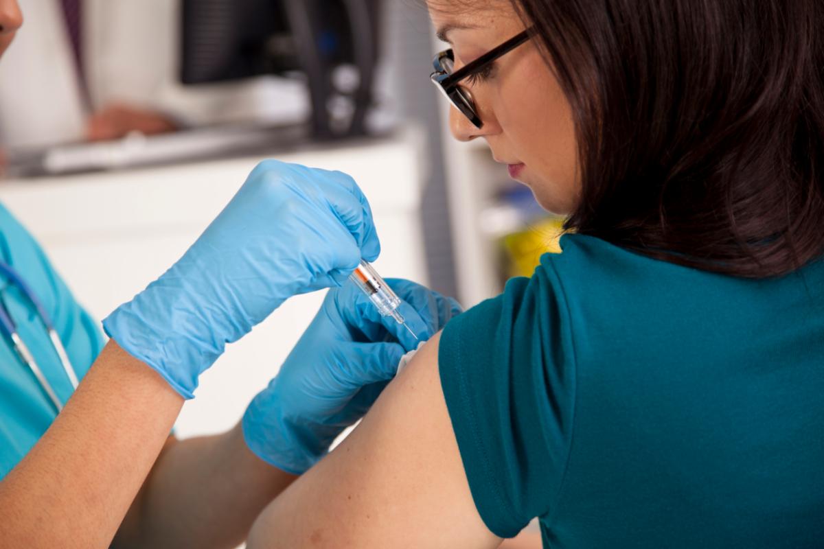 A flu vaccine is administered