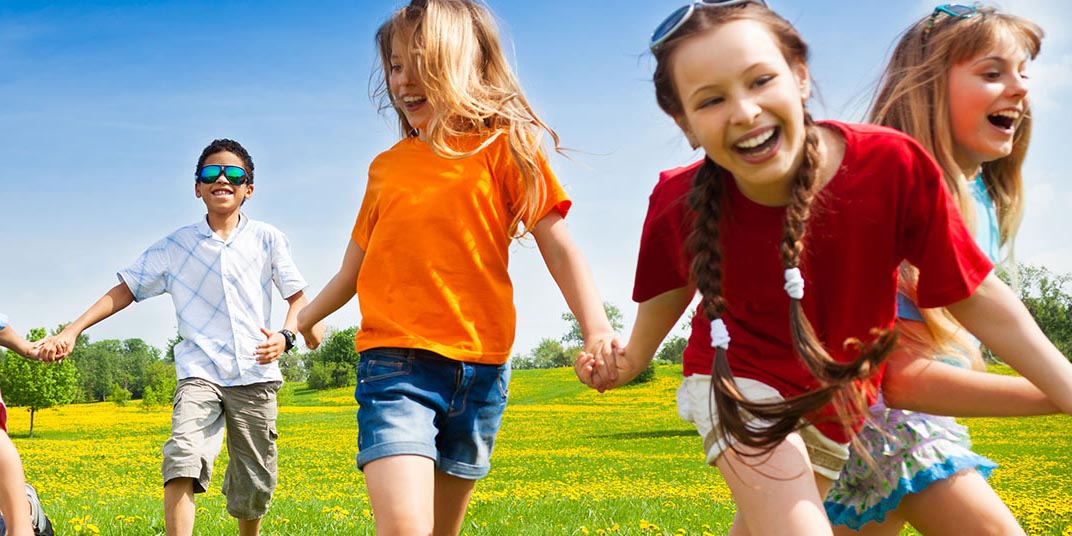 Children running in a field