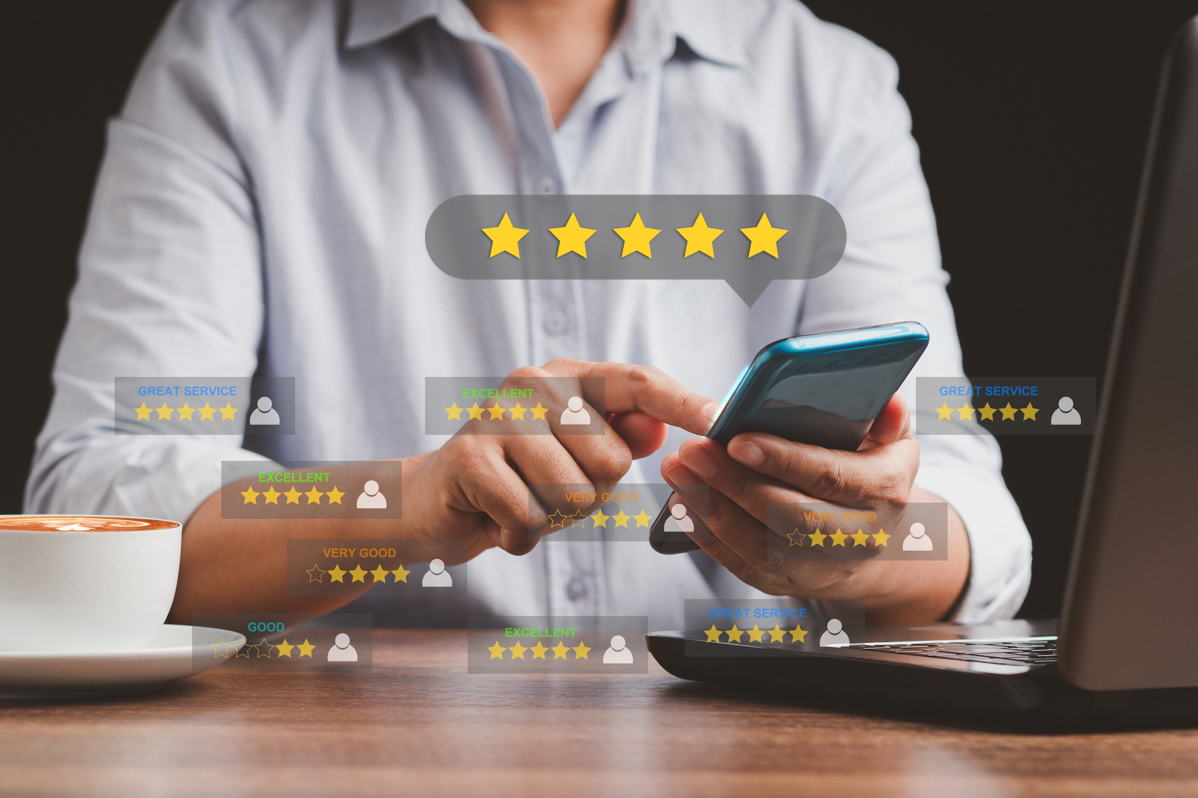 person holding a cell phone with digital review cards showing five gold stars