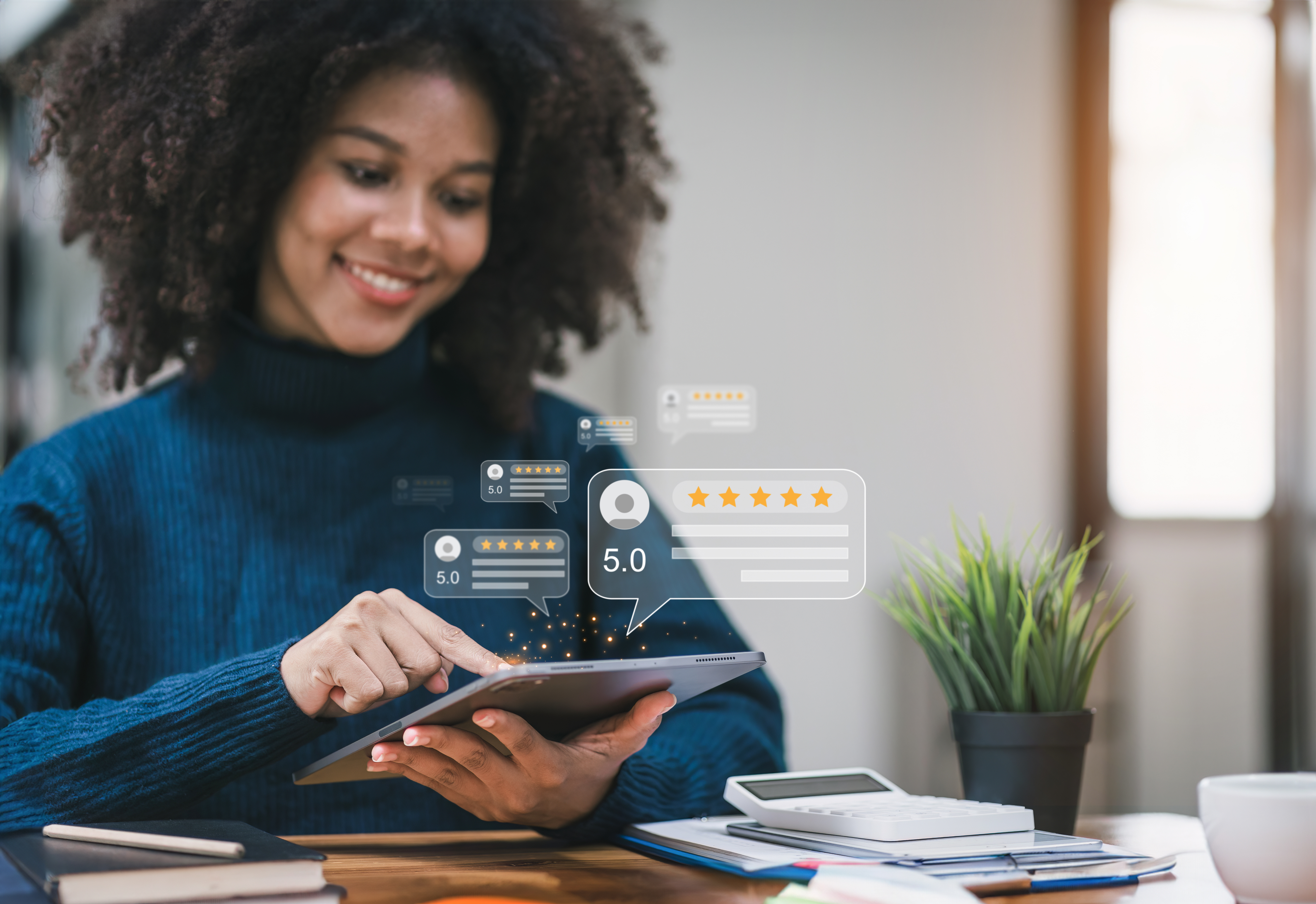 person holding a table with digital review cards showing five gold stars