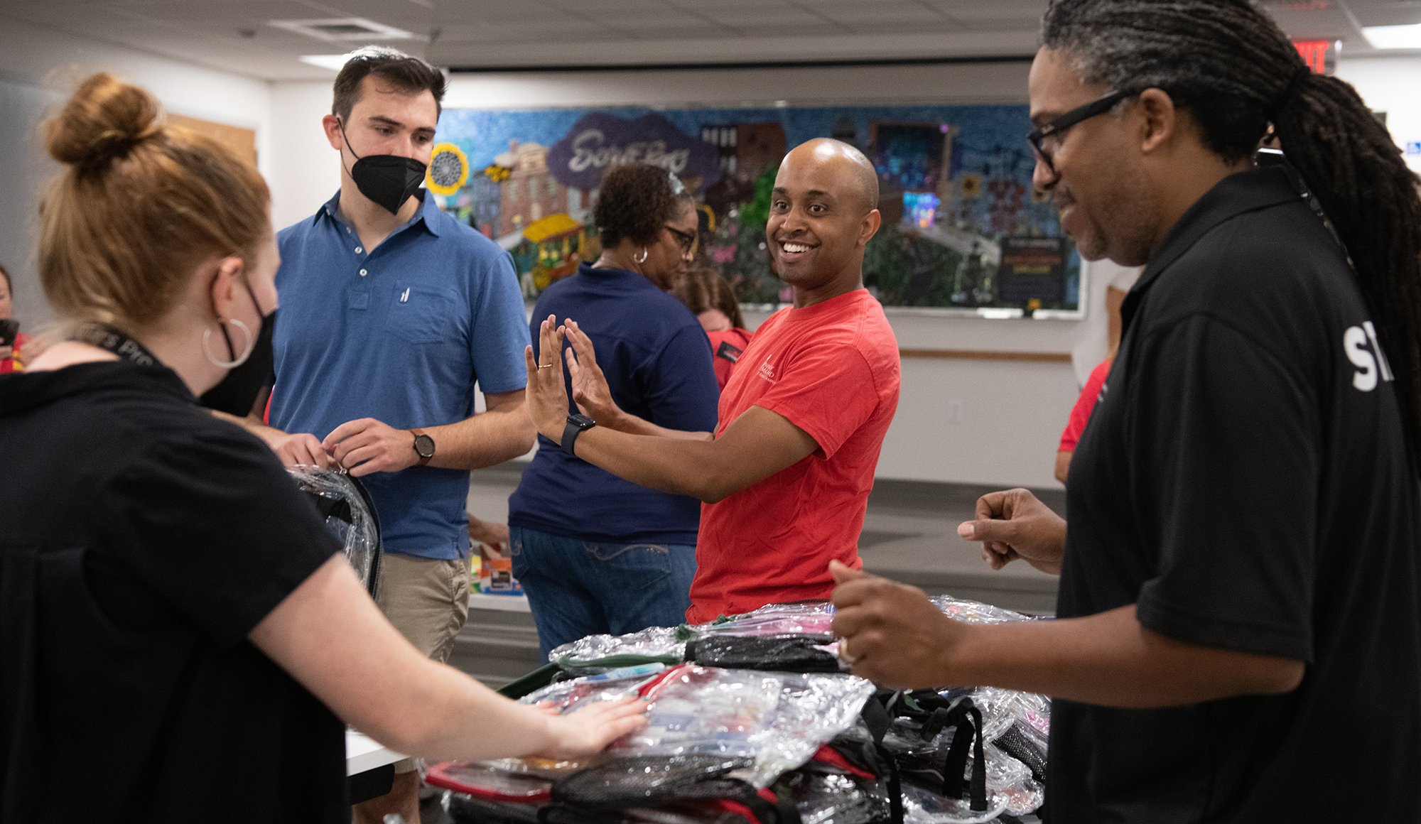 Bill Joyner high-fiving staff