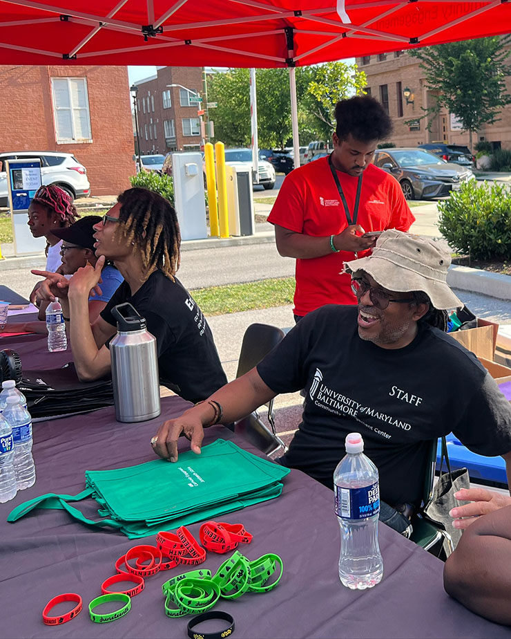 UMB staff man a table at the Juneteenth Jubilee