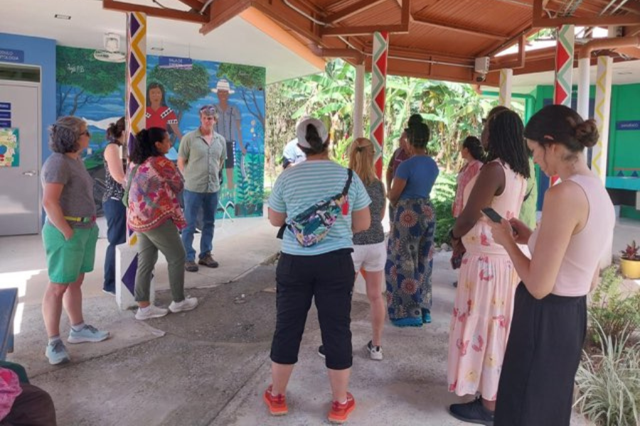 A group of people stand outside a health center in Costa Rica