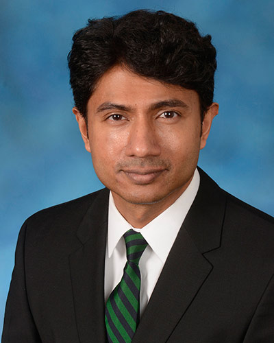 Headshot of man wearing a suit