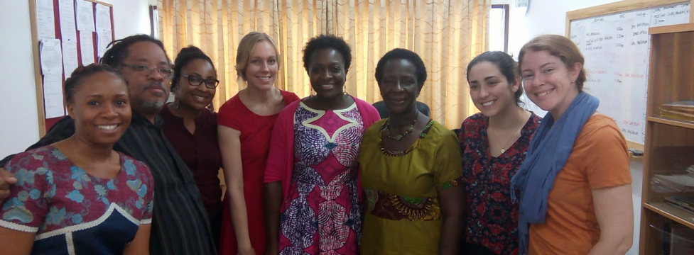 A group of people pose for a photo indoors