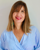 Headshot of woman in a blue shirt