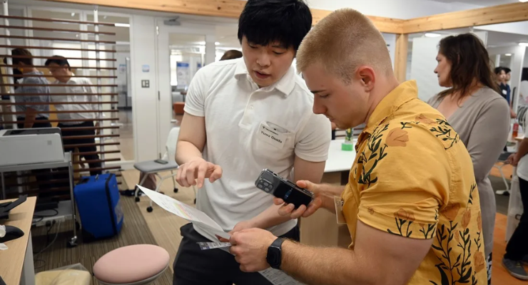 UMB and Japanese students examine a medical device