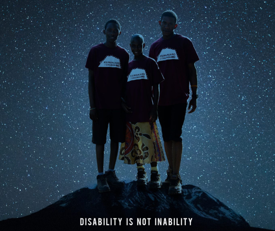 Three people standing on top of a mountain with stars behind them and the words 