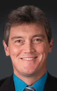 Headshot of a man in a suit