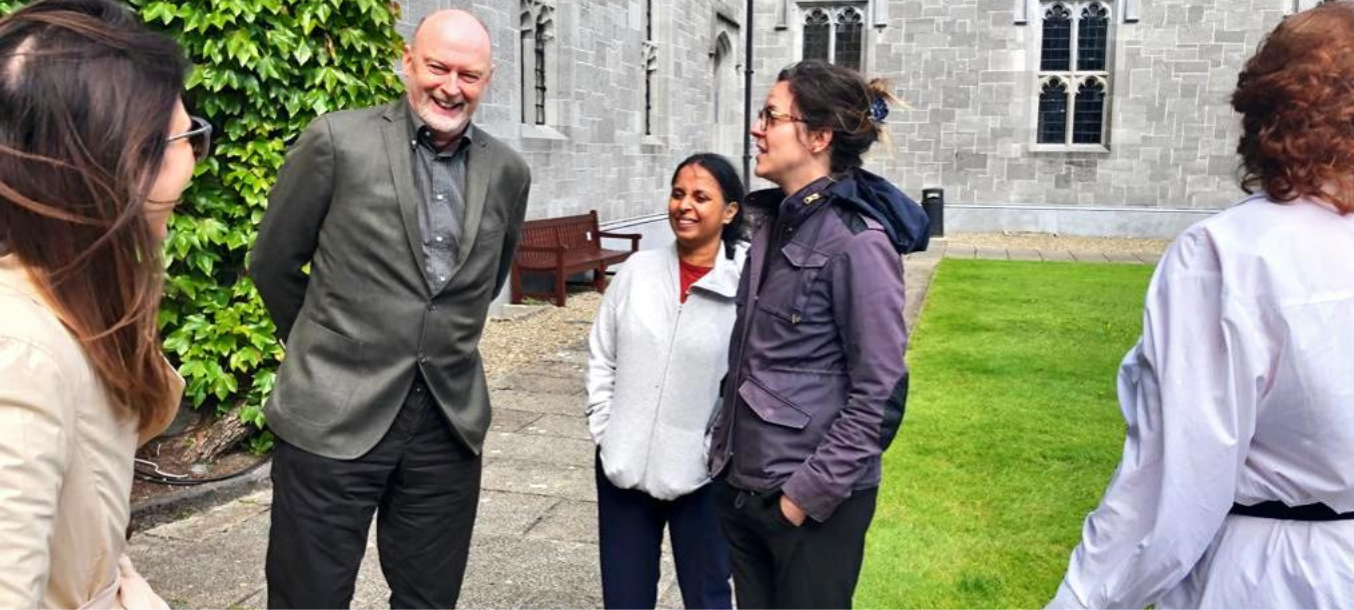 Students and faculty talk outside in Ireland