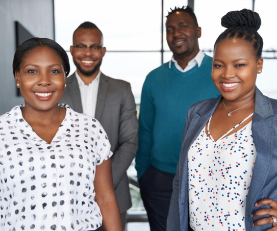 Four students pose for a photo