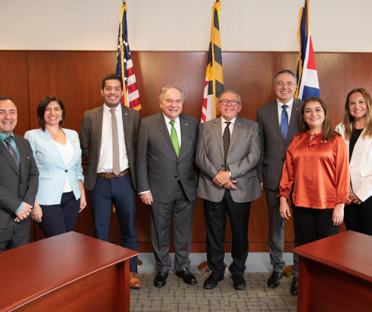 A group of Costa Ricans pose for a photo in the President's Board Room