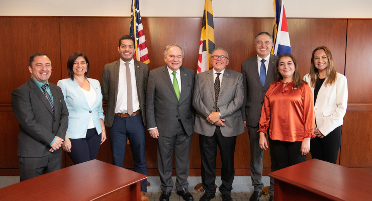 A group of Costa Ricans pose for a photo in the President's Board Room