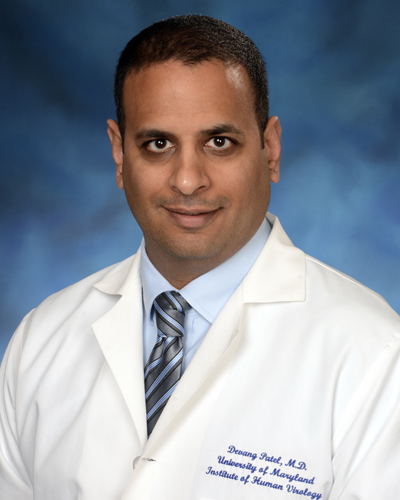 Headshot of man wearing medical jacket