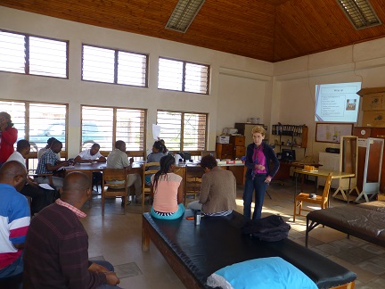 Woman teaching group of students in Malawi