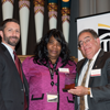 Ardeen Leake, UMB's 2019 Community Service Award winner, poses with Jay A. Perman and others.