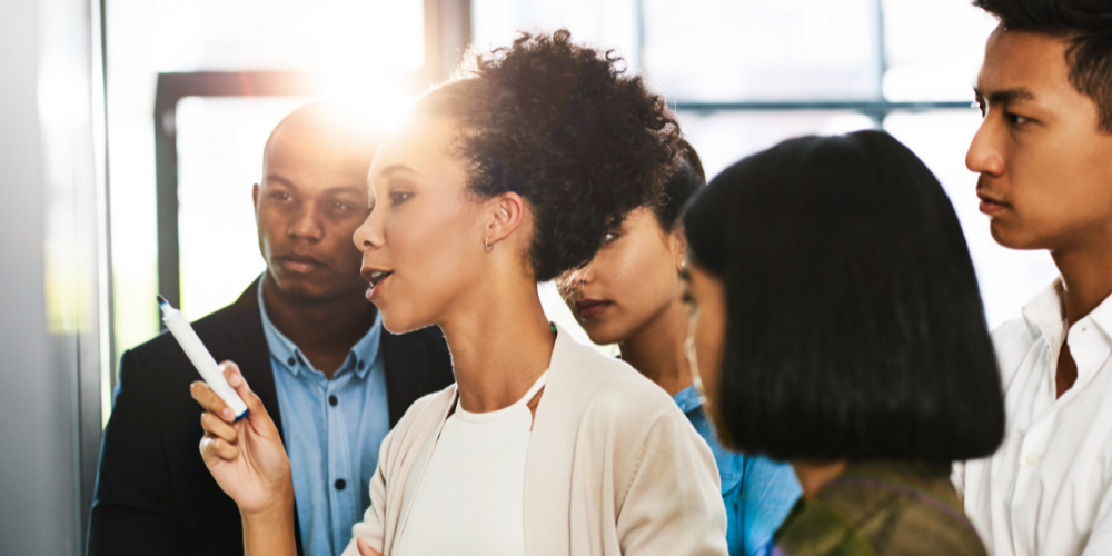 Four employees engage in a learning experience