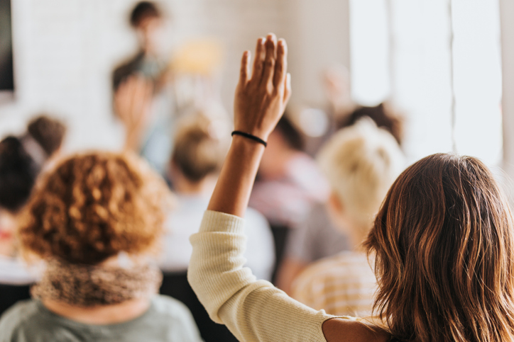 A student raises their hand