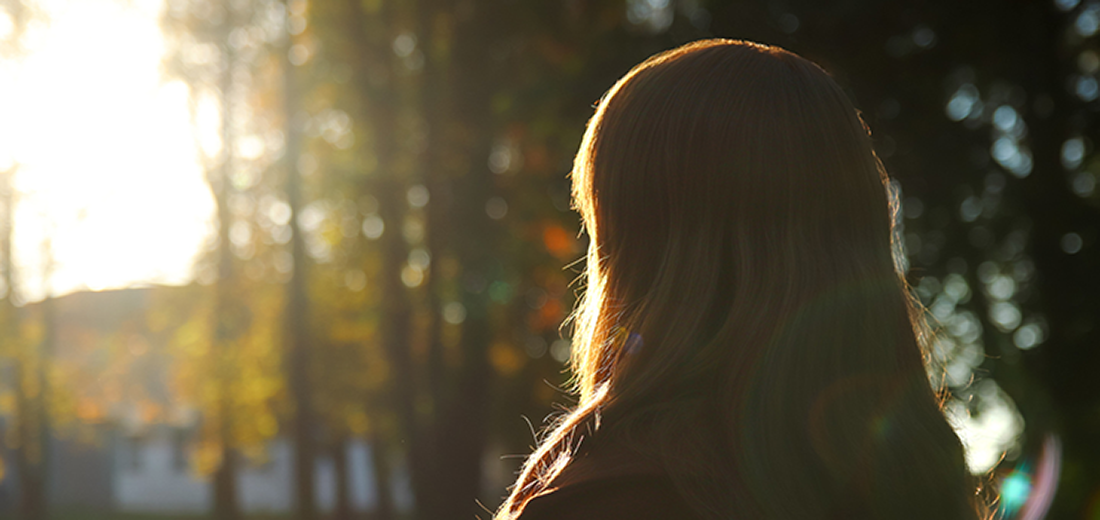 Woman Staring into the Forest