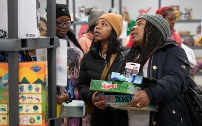 Shoppers look for gifts at the Christmas Store, which was held Dec. 13-14 at the UMB Community Engagement Center.