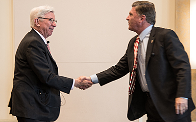 Former Maryland governors Parris N. Glendening, PhD, MA, right, and Robert L. Ehrlich Jr., JD, conclude a discussion at the UMB President's Panel on Politics and Policy on May 1, 2018.