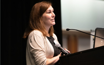 School of Pharmacy Assistant Professor Leah Sera, PharmD, MA, BCPS, director of the MS in Medical Cannabis Science and Therapeutics program, speaks to students at the program's 2019 symposium at the Universities at Shady Grove..              