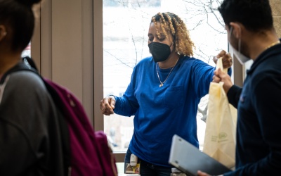 Jolé Ruff, left, and Beatriz Mendez, right, at a UMB Food Pantry pop-up pantry event on Feb. 23.