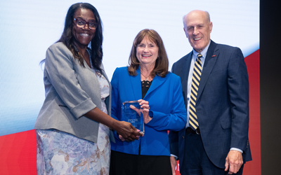 UMSON Dean Yolanda Ogbolu and UMB President Bruce Jarrell present award to Malinda Peeples.