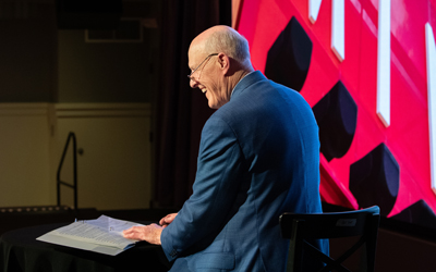 UMB President Bruce Jarrell laughs during State of the University address.