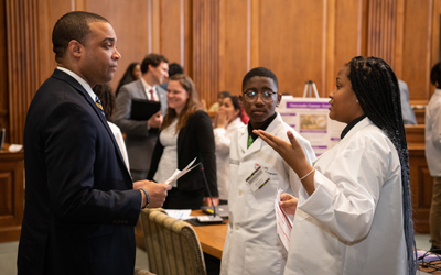 The CURE Scholars present their research to Del. Paul Corderman in the Legislative Services Buildingin of the Maryland State Capital. 