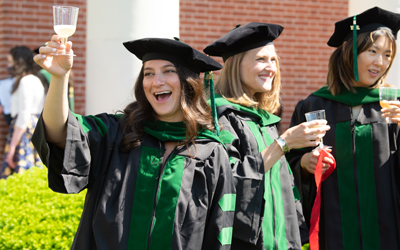 Gabby Segal, MD, toasts herself and her classmates after graduating from the University of Maryland, School of Medicine.