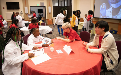 The UMB CURE Scholars in Cohort 5 mix and mingle with potential mentors at the Mentor Mixer after the annual White Coat Ceremony (Oct. 2019).