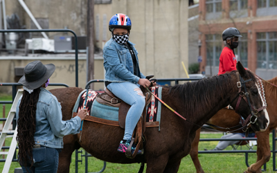 The University of Maryland, Baltimore is partnered with City Ranch to bring a free, youth horseback riding program to West Baltimore. 