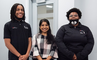 Jaden Buggs (left) and Princaya Sanders (right), both Cohort 1 in the UMB CURE Scholars Program, celebrate their summer of success with their mentor, Sindhushree Raghunandar, PhD, a staff engineer at Becton Dickinson.