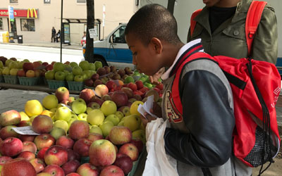 The Kids to Farmer’s Market Program is a hands-on learning experience for West Baltimore third graders. The program brings the children to a local farmer's market to buy local produce and learn about nutrition and healthy eating habits.