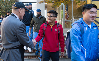 UMB President Bruce Jarrell, MD, FACS, greets some of the 600-plus students who attended the Founders Week Student cookout Oct. 27 at the School of Nursing Courtyard.