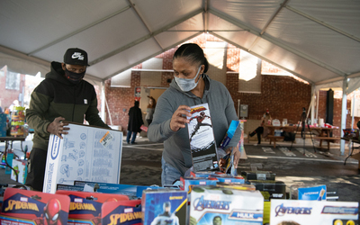 Tented, outdoor setup gave UMB’s West Baltimore neighbors the opportunity to buy new gifts for their loved ones at deep discounts.