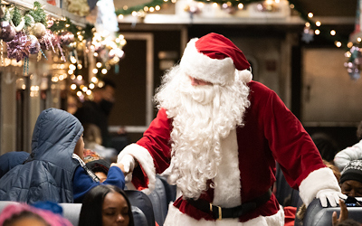 Neighbors in West Baltimore board the Polar Express at teh B&O Railroad museum.