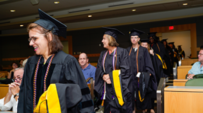 A line of people graduating