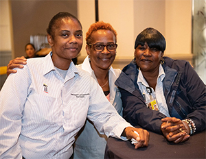 Three staff members socializing together